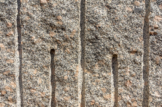 Marble Quarry Background: Close-up of Drill Grooves.