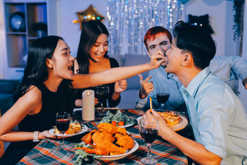 Diversity, dinner and group of people toast celebration together at party. Friends, happy and celebrate with food, wine and friendship for love, support and cheers champagne at business function