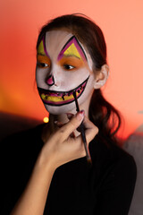 a girl's face was painted make up for Halloween