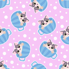 Fototapeta premium Seamless pattern with blue teacups and cute cartoon kittens. Suitable for wallpaper, backgrounds, fabric, wrapping paper, etc. Vector