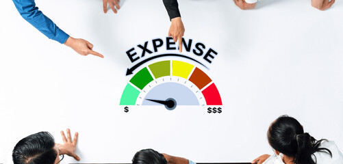 A diverse group of professionals collaborates in a business meeting, analyzing expense management...