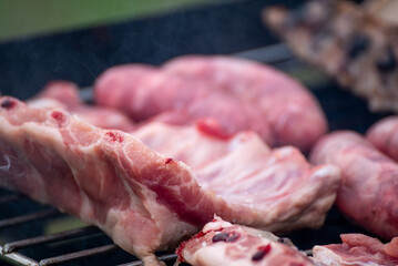 A Close up of a Raw Pork Ribs on a Grill The Concept of a Food Preparation