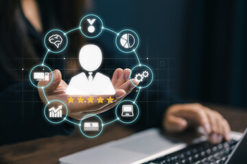 Businesswoman using laptop with customer experience management graphic. Concept of CRM, customer satisfaction, loyalty program, and digital marketing analytics in modern business.