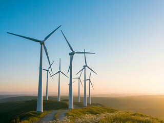 Obraz premium A single wind turbine provides clean, renewable energy on a mountain windfarm at sunset