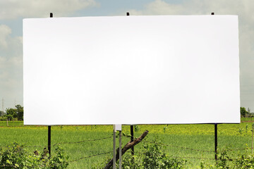 billboard on rural area of India, outdoor advertising, mockup billing board in front of green tree and Blank white background for branding design large hoarding, Outdoor advertising construction.