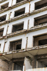 Facade of the abandoned high rise building construction site. Concept
