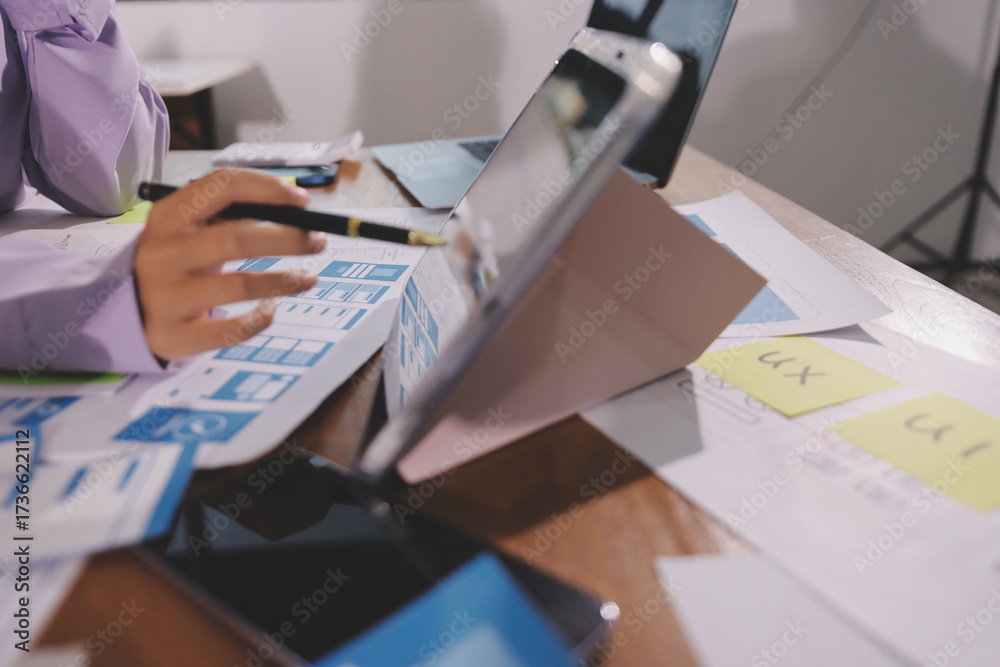 Wall mural close up ux developer and ui designer brainstorming about mobile app interface wireframe design on t