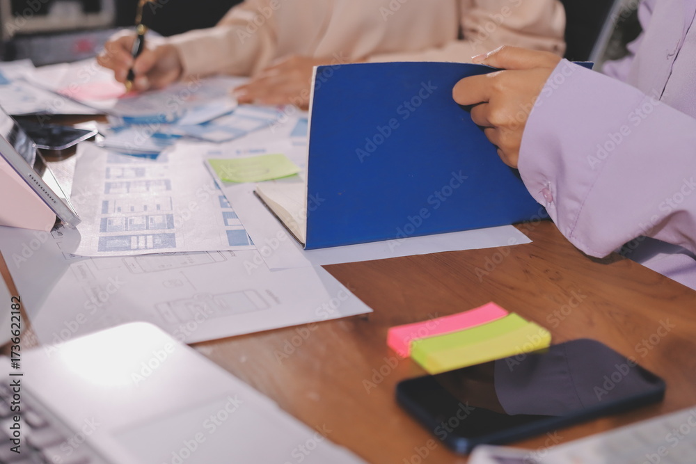 Wall mural close up ux developer and ui designer brainstorming about mobile app interface wireframe design on t