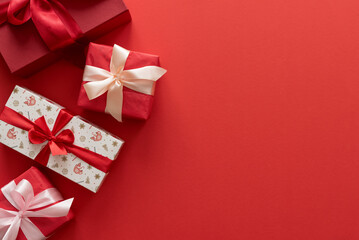 Border from Christmas gifts on a red background.