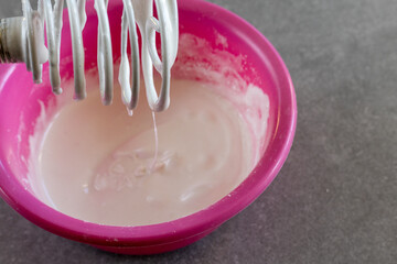 Whipped icing in mixing bowl
