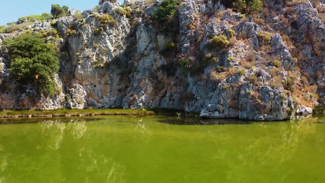 footage showcasing the serene natural beauty of Iztuzu Beach in Dalyan, Turkey. Known as Turtle Beach, this pristine 4.5 km long stretch of sand is a vital nesting ground for endangered loggerhead sea