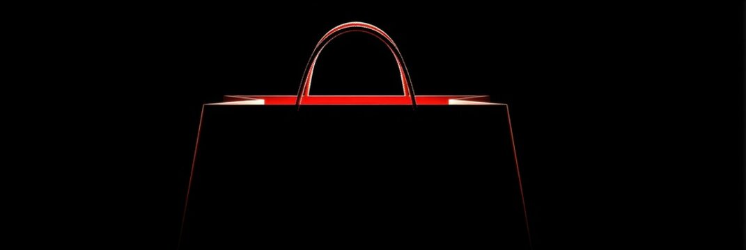 A sleek shopping bag featuring striking red details stands out against a solid black background, emphasizing its modern and elegant shape.
