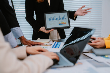 Close-up of business people group meeting and using check chart in office, brainstorming and...