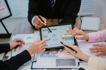 Group of business people at meeting in office, close-up. Team of two women discussing deal. Negotiation concept