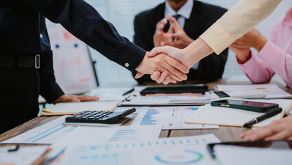 Group of business people at meeting in office, close-up. Team of two women discussing deal. Negotiation concept