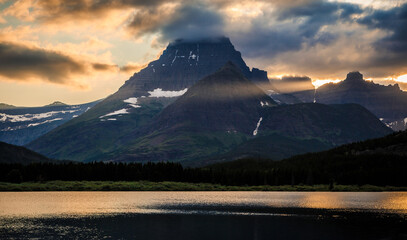 Sunset Light Through the Mountains of Glacier above Swiftcurrent Lake, Many Glacier, Glacier National Park, Montana