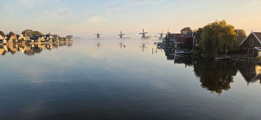 Zaanse Schans windmills at a froggy sunrise, the Netherlands