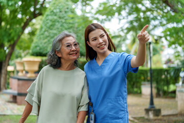 Caregiver provides assistance and support to senior, showcasing moment of joy and connection in serene outdoor setting. bond between them highlights importance of care and companionship