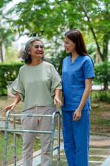 Caregiver provides assistance and support to senior in park, showcasing importance of care and companionship in daily life. scene reflects warmth and connection