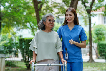 Caregiver provides assistance and support to senior in park, showcasing importance of care and companionship in enhancing quality of life