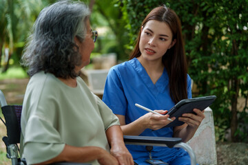 Caregiver provides assistance and support to senior in serene outdoor setting, ensuring quality care and fostering compassionate connection