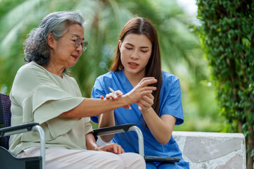 Caregiver provides assistance and support to senior in need of care, demonstrating compassion and dedication in serene outdoor setting