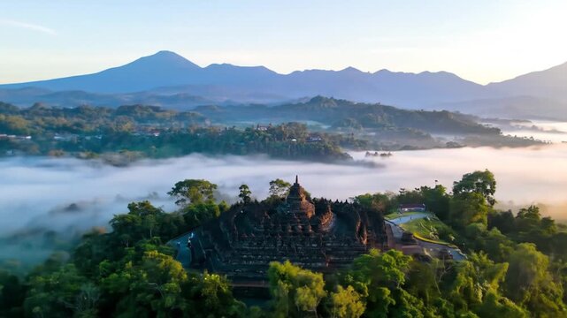 Borobudur Temple at Sunrise A Mystical Landscape with Volcanic Mountains