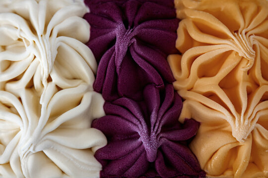 Close-up of colorful textured ice cream swirls
