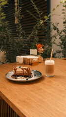 Delicious dessert and coffee on a wooden table in a cafe setting