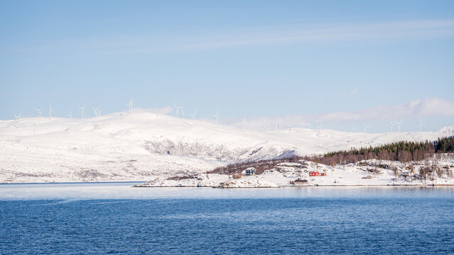 Snowy Norwegian landscape with wind turbines in Kvaloysletta