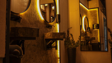 Stylish restroom interior with modern design and warm lighting