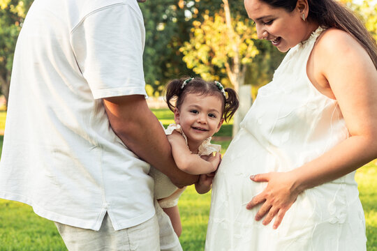 Happy family enjoying time outdoors in a sunny park