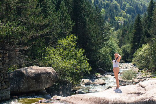 Woman enjoying nature in Barruera, Pyrenees, Spain
