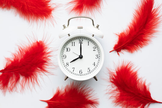 Clock with red feathers symbolizing menstruation