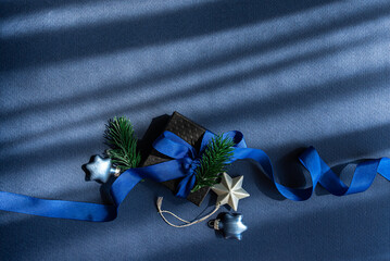 Blue Christmas gift box with festive decorations