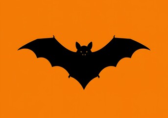 Fototapeta premium Silhouette of a black bat flying against a bright orange background