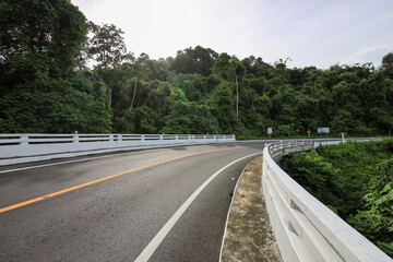 Road with a white railing on the side