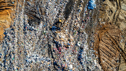 County Landfill from Above: Dump Trucks and Machinery in Action