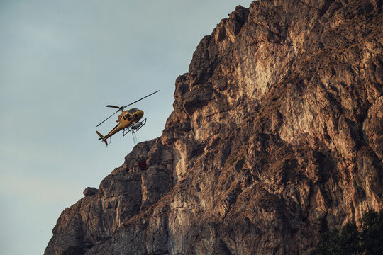 Helicopter aiding in forest fire control in Asturias