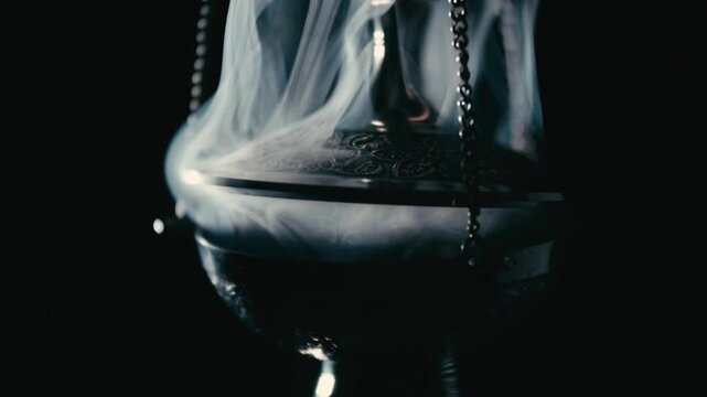 Incense smoke rising from censer