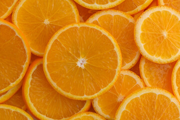 Fresh oranges sliced into rounds as food background