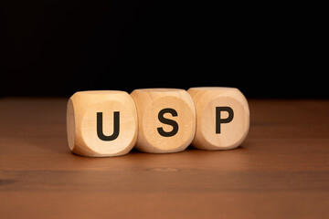 Wooden cubes with letters USP symbolizing Unique Selling Proposition in business concept