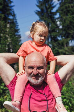 Grandfather and granddaughter enjoying a day in nature