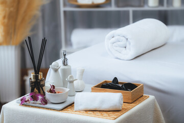 Exquisite display of beauty treatment and spa salon accessories arranged on spa table in luxury spa resort. Relaxing spa massage and recreation background concept. Quiescent