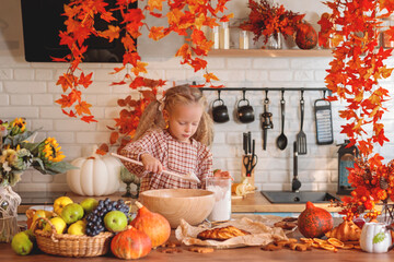 autumn still life. Happy little girl playing with dough and baking a pie in a rustic kitchen full of autumn harvest decorations, including pumpkins, fruit, and fall leaves. autumn season.