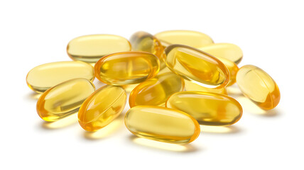 Pile of translucent yellow vitamin capsules on a white background