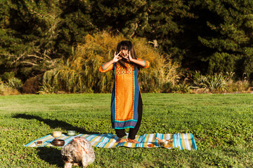 Woman preparing sound bath ceremony in autumn