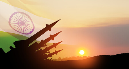 The missiles are aimed at the sky at sunset with Indian flag. Nuclear bomb, chemical weapons, missile defense, a system of salvo fire.