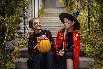 Two girls in Halloween costumes enjoy festive fun