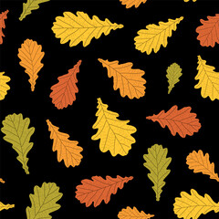 Abstract botanical pattern. Seamless print composed of green, yellow, red, orange silhouette of leaves of oak on black background. Botanical colorful background.